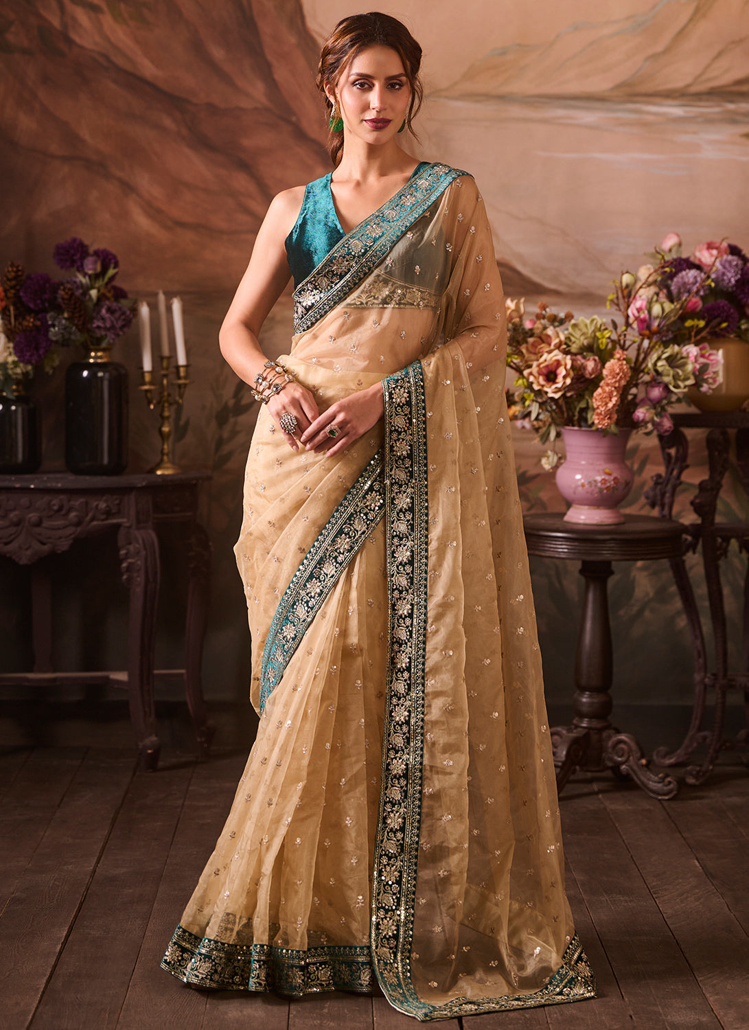 Beige and Blue Embroidered Velvet Saree